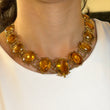 Antique Georgian Victorian Natural Oval Cut Citrine Necklace in 14K & 22K Yellow Gold with leaf and scroll motifs, on model.