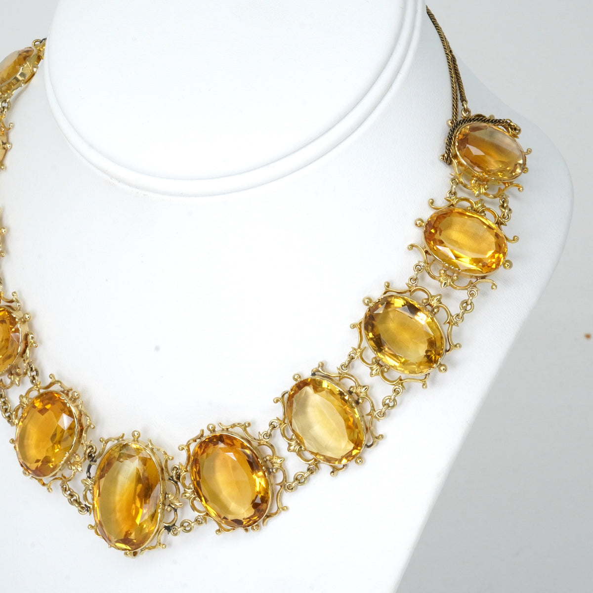 Antique Georgian Victorian Natural Oval Cut Citrine Necklace in 14K & 22K Yellow Gold with leaf and scroll motifs, on a bust.