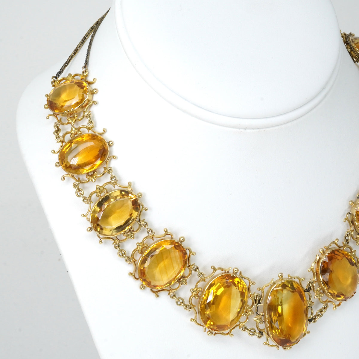 Antique Georgian Victorian Natural Oval Cut Citrine Necklace in 14K & 22K Yellow Gold with leaf and scroll motifs, on a bust.