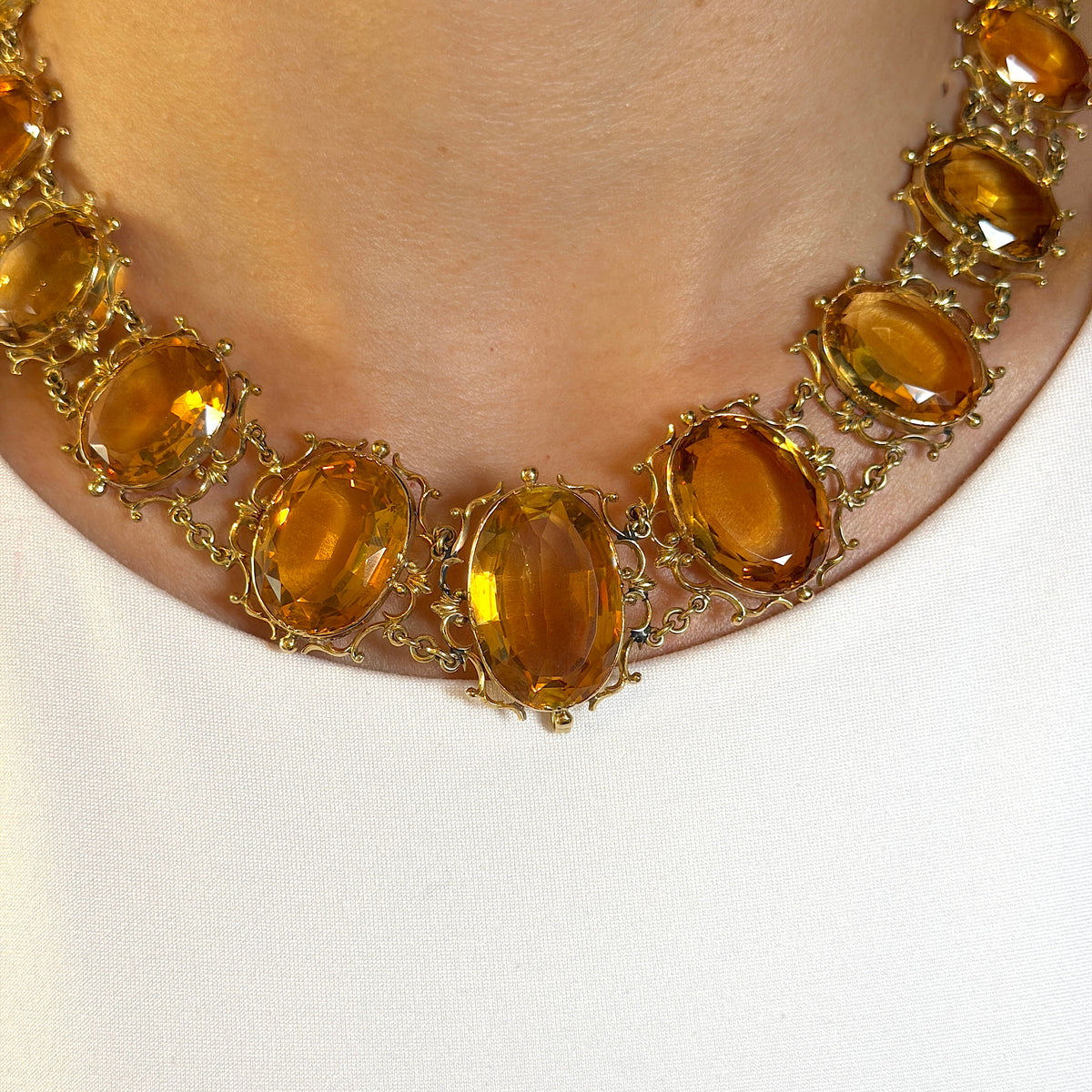 Antique Georgian Victorian Natural Oval Cut Citrine Necklace in 14K & 22K Yellow Gold with leaf and scroll motifs, on model.