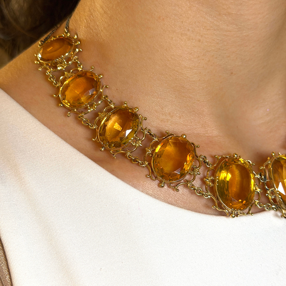 Antique Georgian Victorian Natural Oval Cut Citrine Necklace in 14K & 22K Yellow Gold with leaf and scroll motifs, on model.