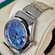 Rolex Oyster Perpetual Date 34mm Blue Mosaic Dial Smooth Bezel Stainless Steel REF. 1500 Blue Mosaic Dial Year 1971 Riveted Bracelet