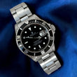 Rolex Submariner Date 40 Steel Automatic Black Dial Black Bezel Oyster Bracelet REF 16800 Year 1984 Rolex Service Papers