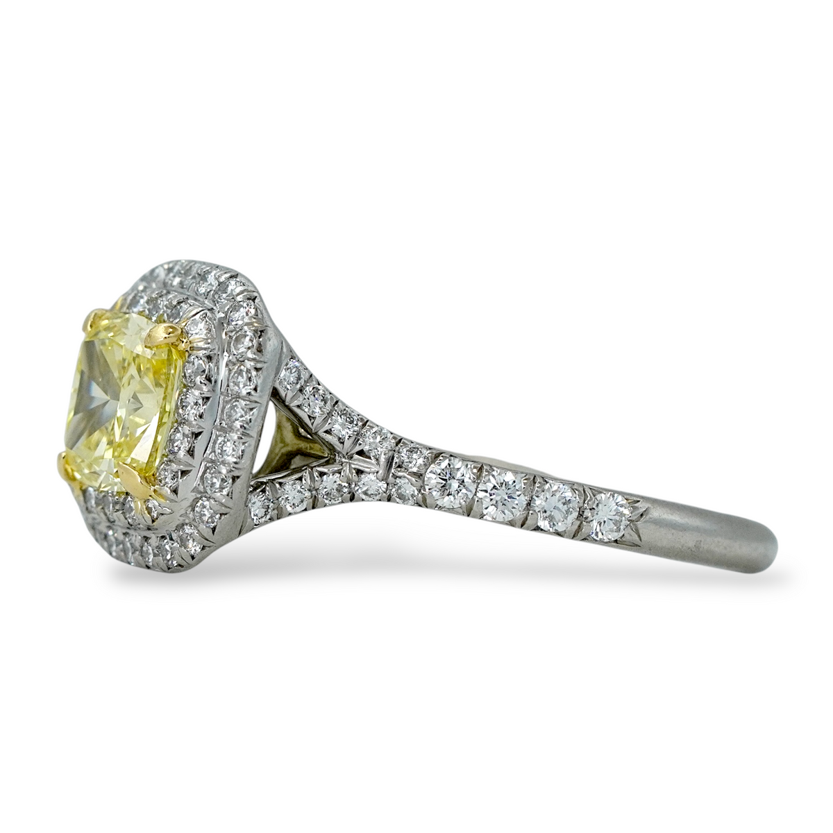 Tiffany and Co Soleste diamond and platinum ring with a 0.78 ct Fancy Intense yellow cushion cut diamond, side view.