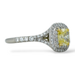 Tiffany and Co Soleste diamond and platinum ring with a 0.78 ct Fancy Intense yellow cushion cut diamond, side view.