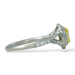 Tiffany and Co Soleste diamond and platinum ring with a 0.78 ct Fancy Intense yellow cushion cut diamond, side view.