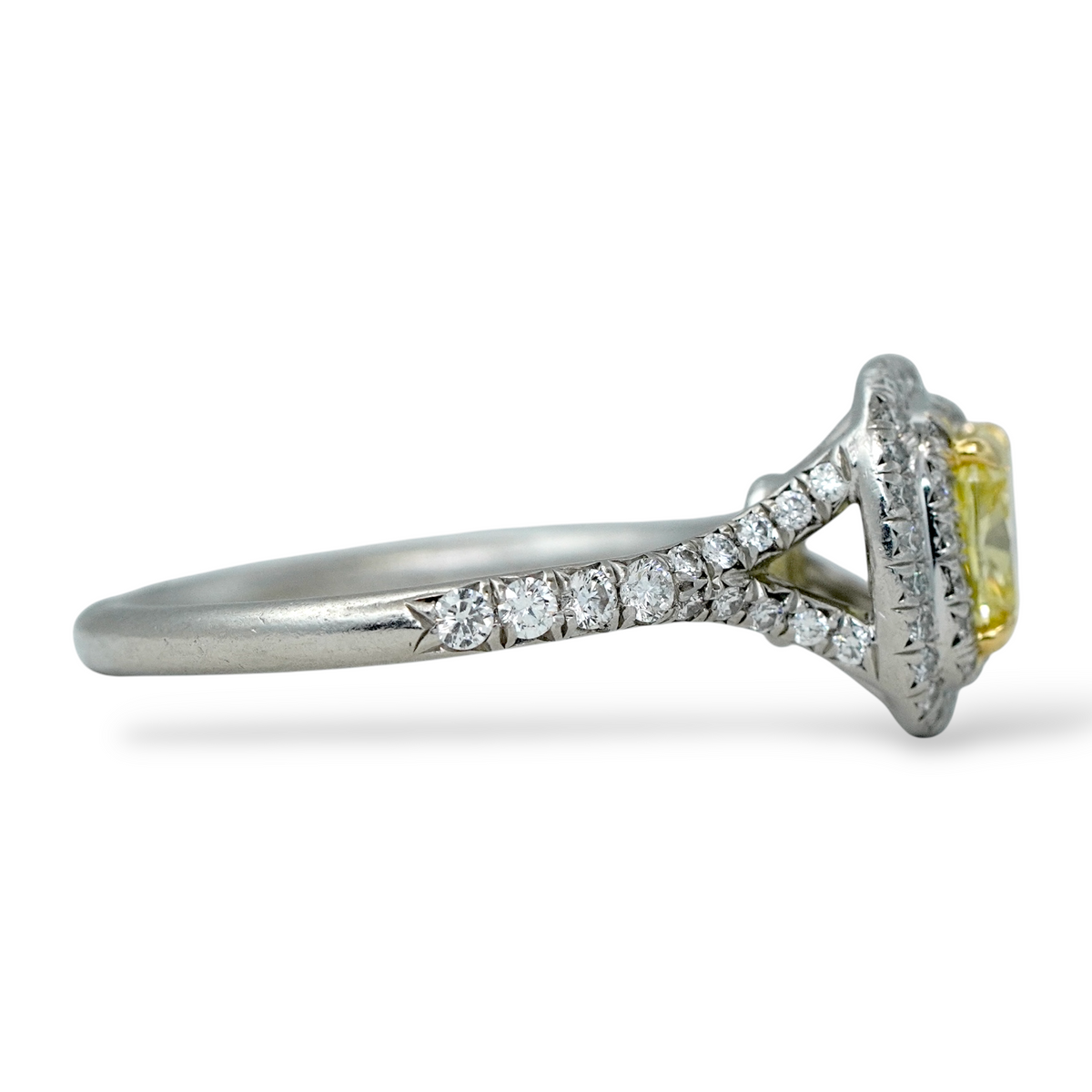 Tiffany and Co Soleste diamond and platinum ring with a 0.78 ct Fancy Intense yellow cushion cut diamond, side view.