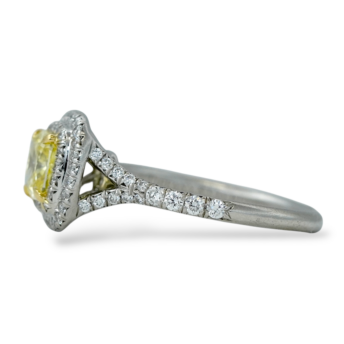 Tiffany and Co Soleste diamond and platinum ring with a 0.78 ct Fancy Intense yellow cushion cut diamond, side view.